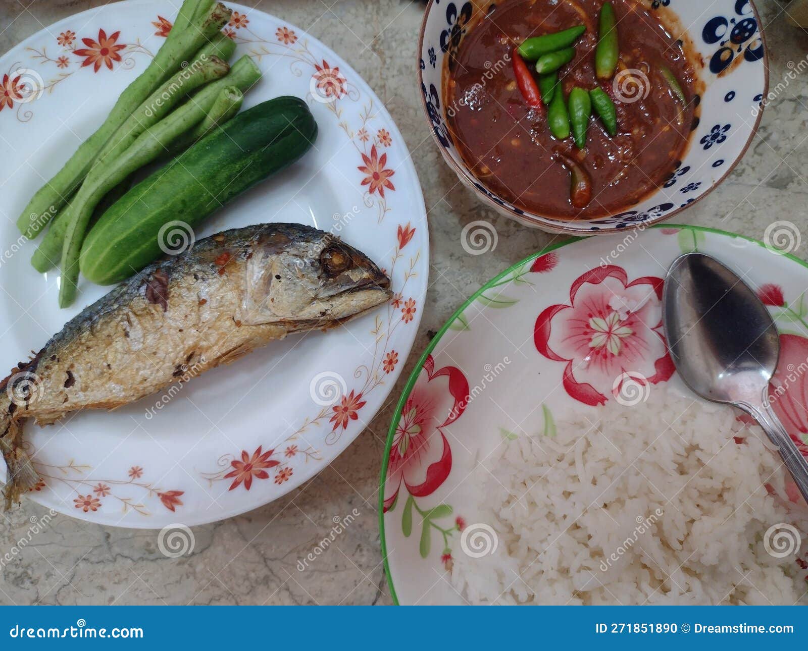 Fried Mackerel with Chili Paste and Vegetables on Rice Stock Photo