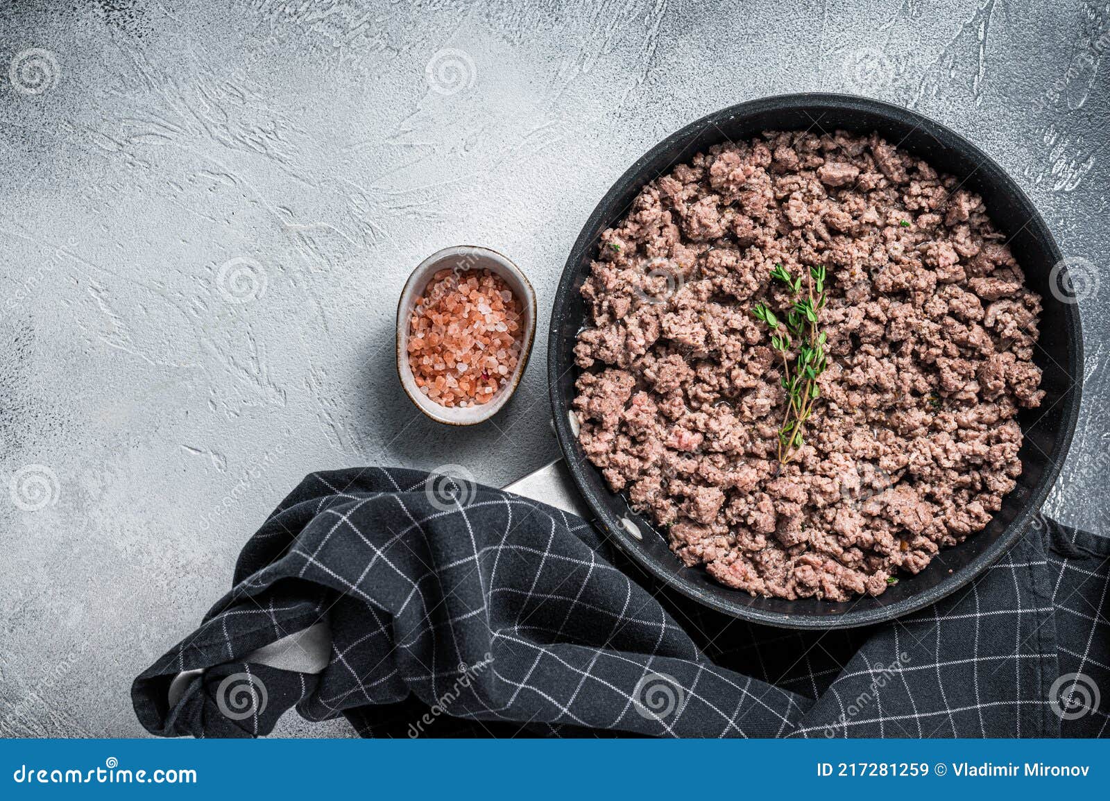 Fried Mince Beef and Lamb Meat in a Pan with Herbs. White Background