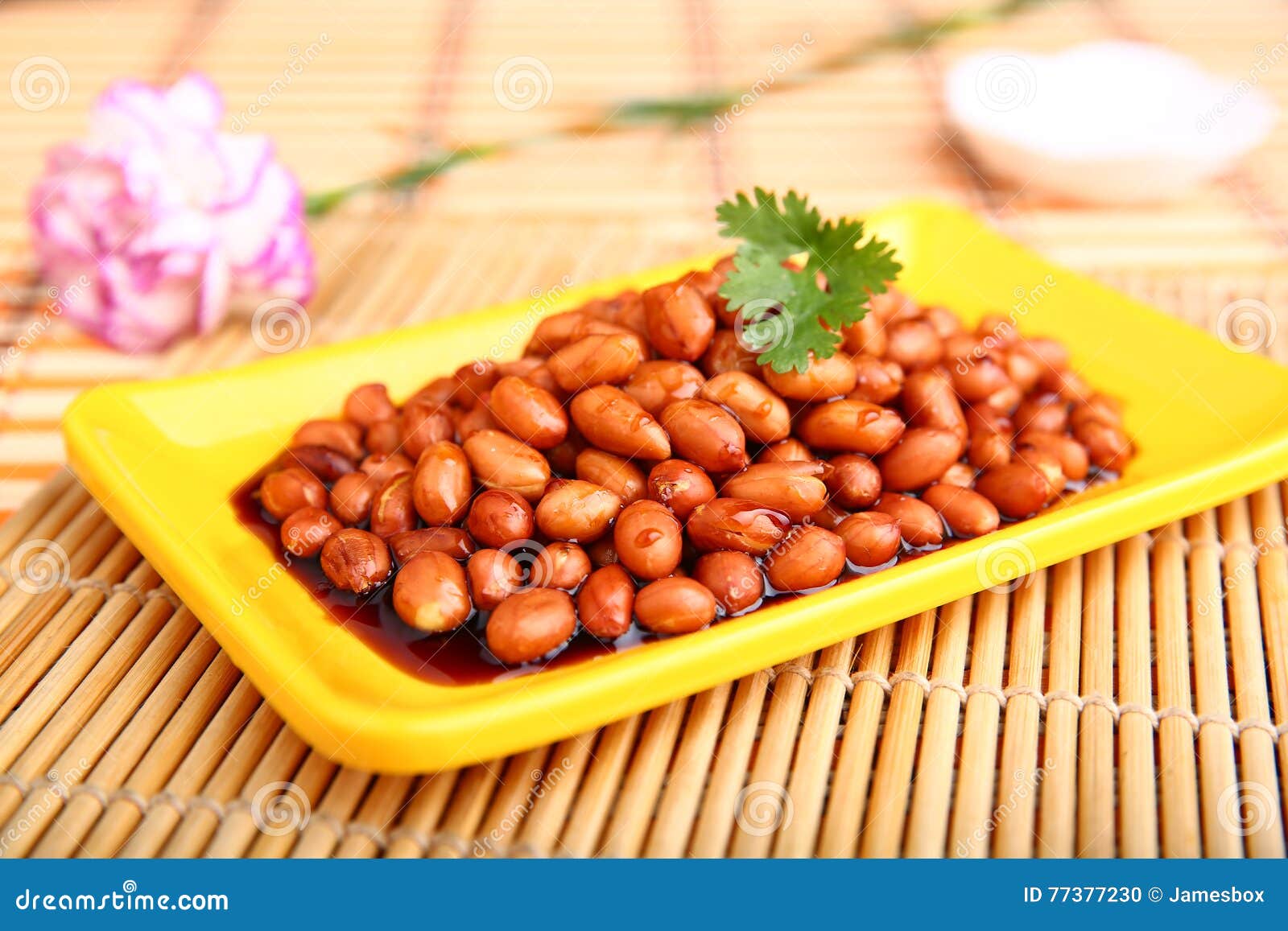 Fried Peanuts With Sauce On Yellow Plate On The Table In Restaurant