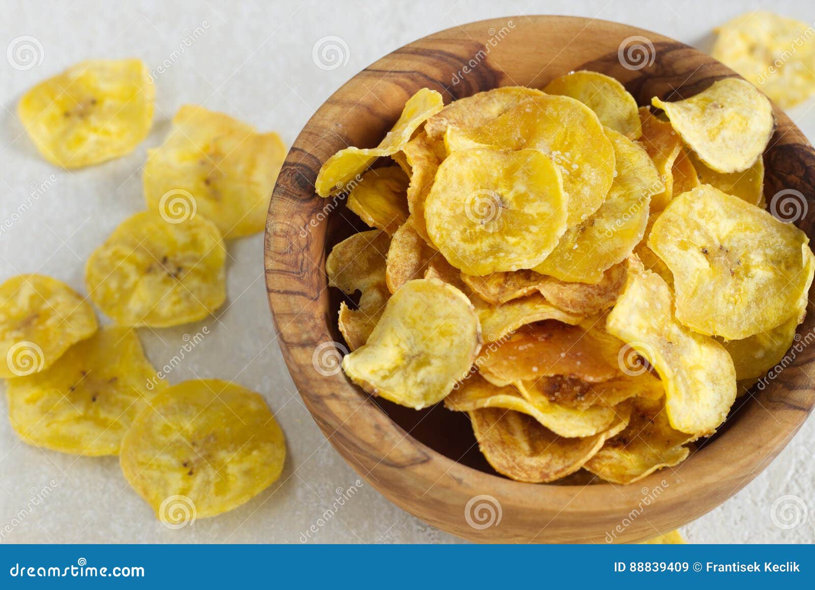 fried plantain chips in a wooden bowl.