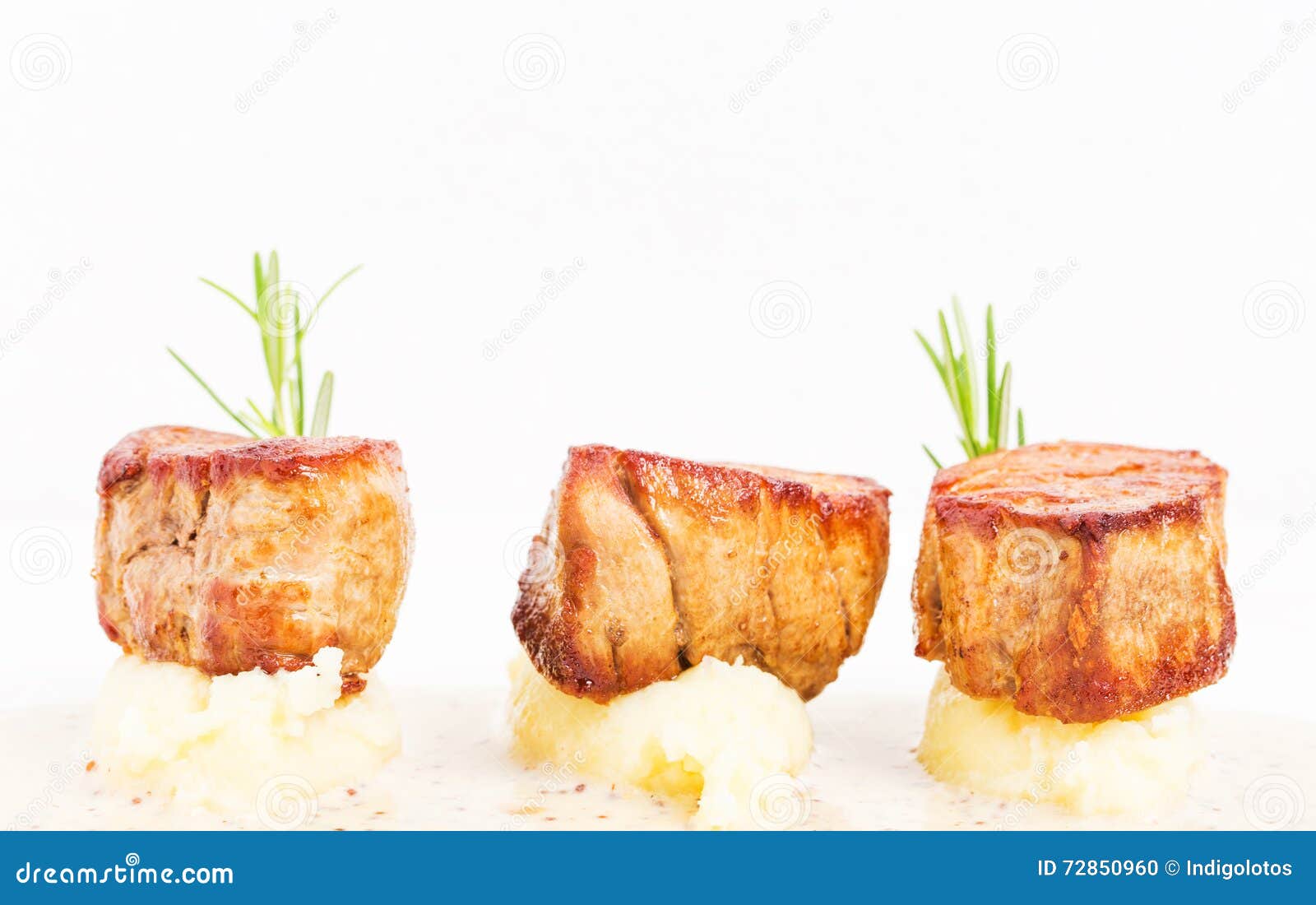 Fried Pork Tenderloin Medallions on Mashed Potatoes. Stock Photo ...