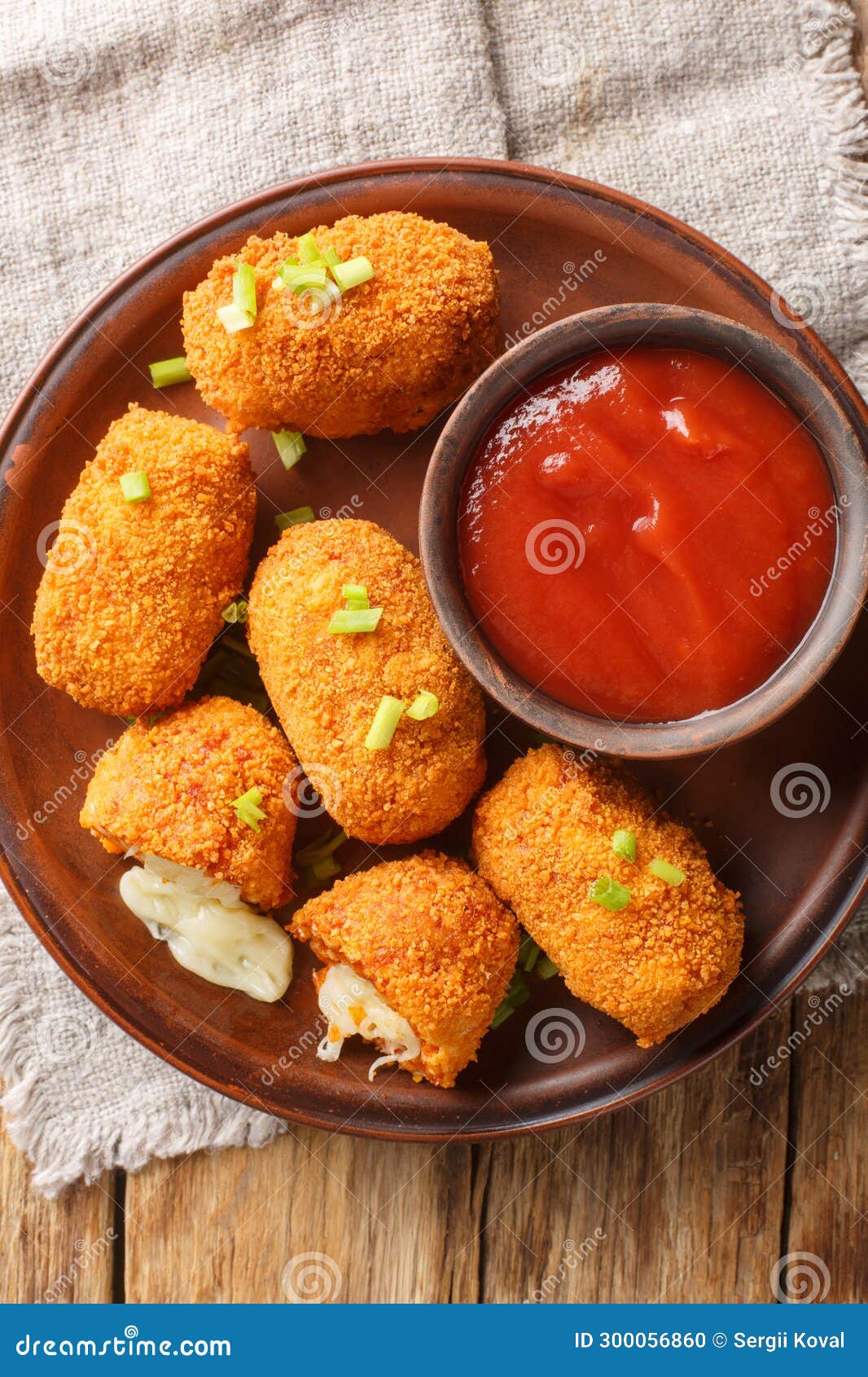 fried rice balls stuffed with mozzarella suppli al telefono closeup on the plate. vertical top view