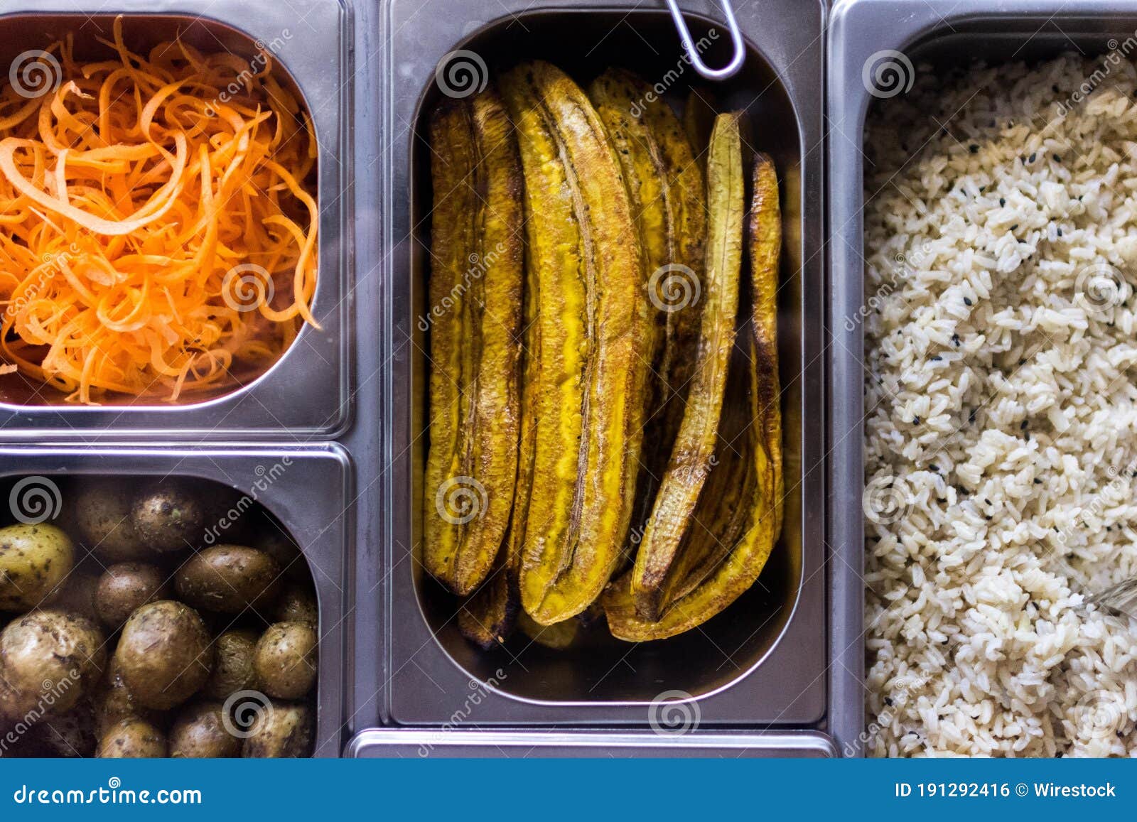 Fried Rice with Eggplants, Potatoes, and Carrots in a Cafeteria Stock