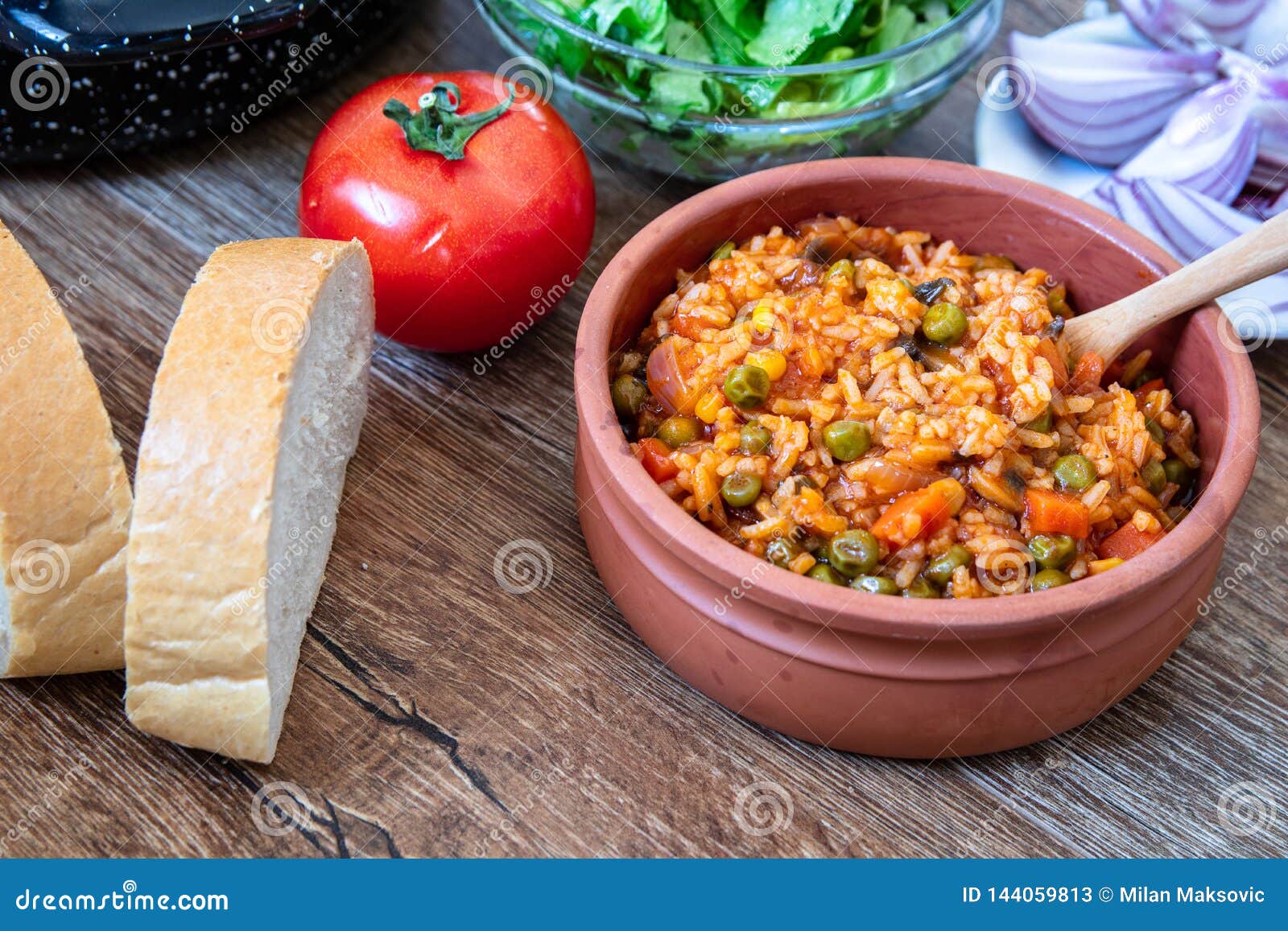 Fried Rice with Vegetables and Spices in a Vintage Clay Bowl Stock