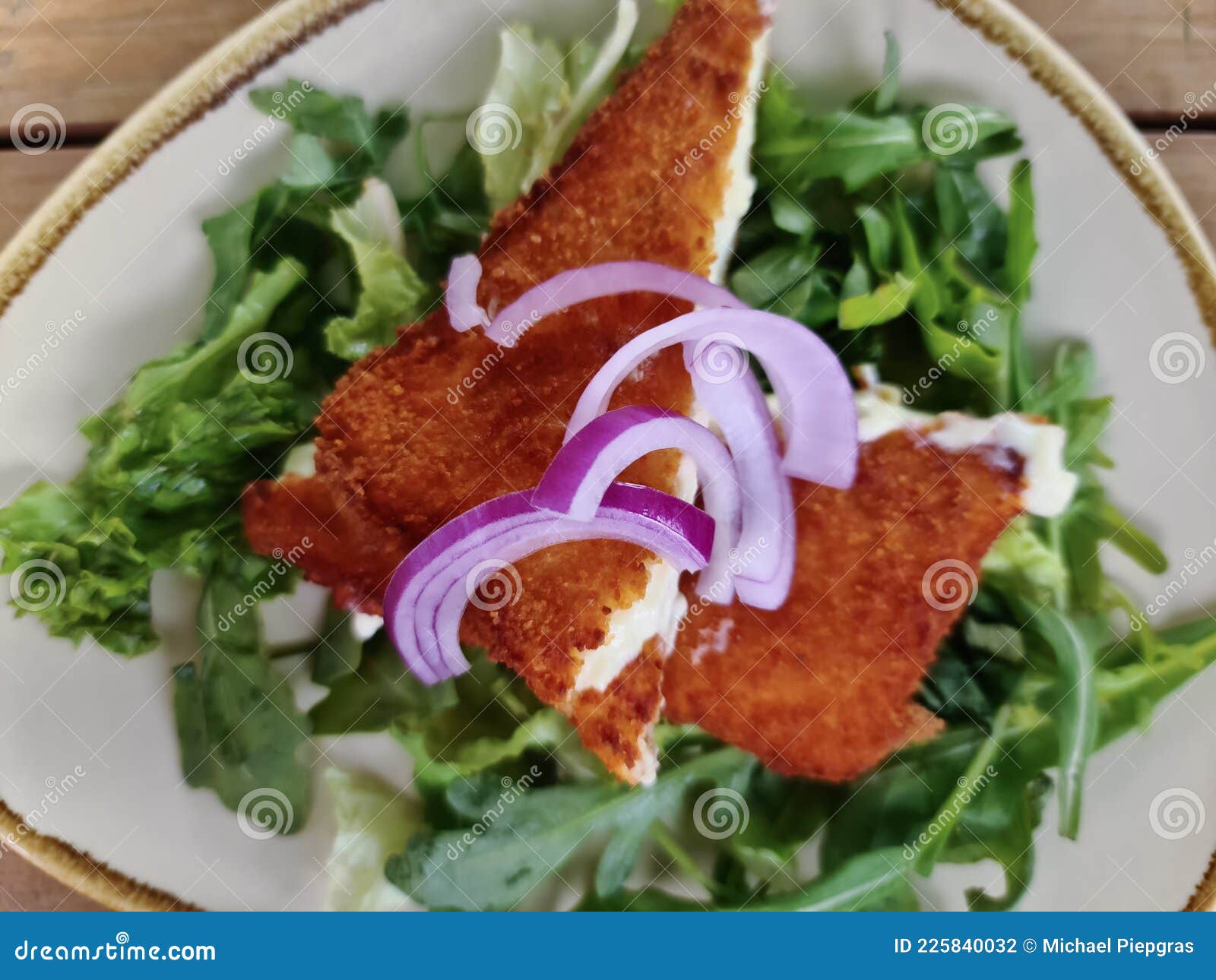 Fried Saganaki Cheese Served on a Plate with Green Salad Stock Photo ...