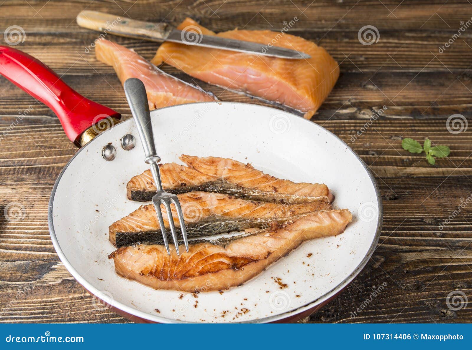 Fried Salmon Fillets on the Pan on the Wood. Stock Photo Image of