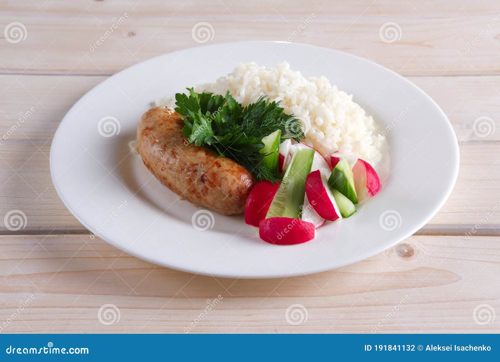 Fried Sausage with Rice and Fresh Cucumber and Radish Stock Photo