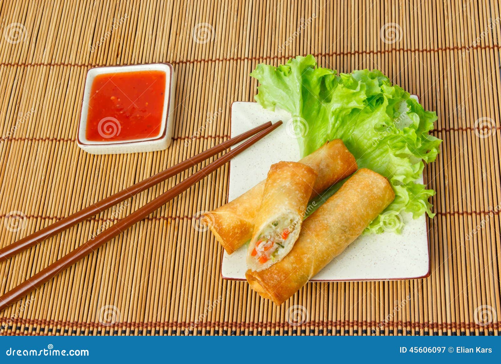 Fried Spring Rolls, One Cut, on a Plate with Chopsticks Stock Image Image of crispy, lettuce