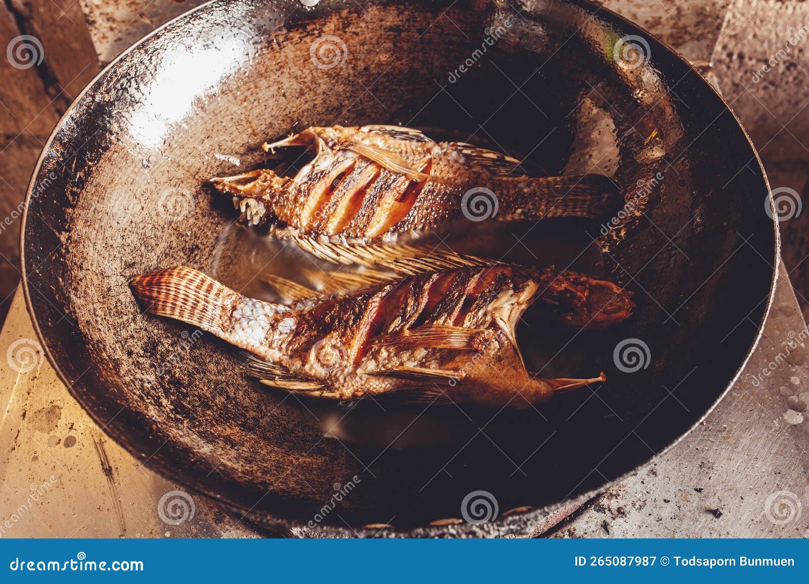 Fried Tilapia in an Iron Pan Over Medium Heat Stock Image Image of