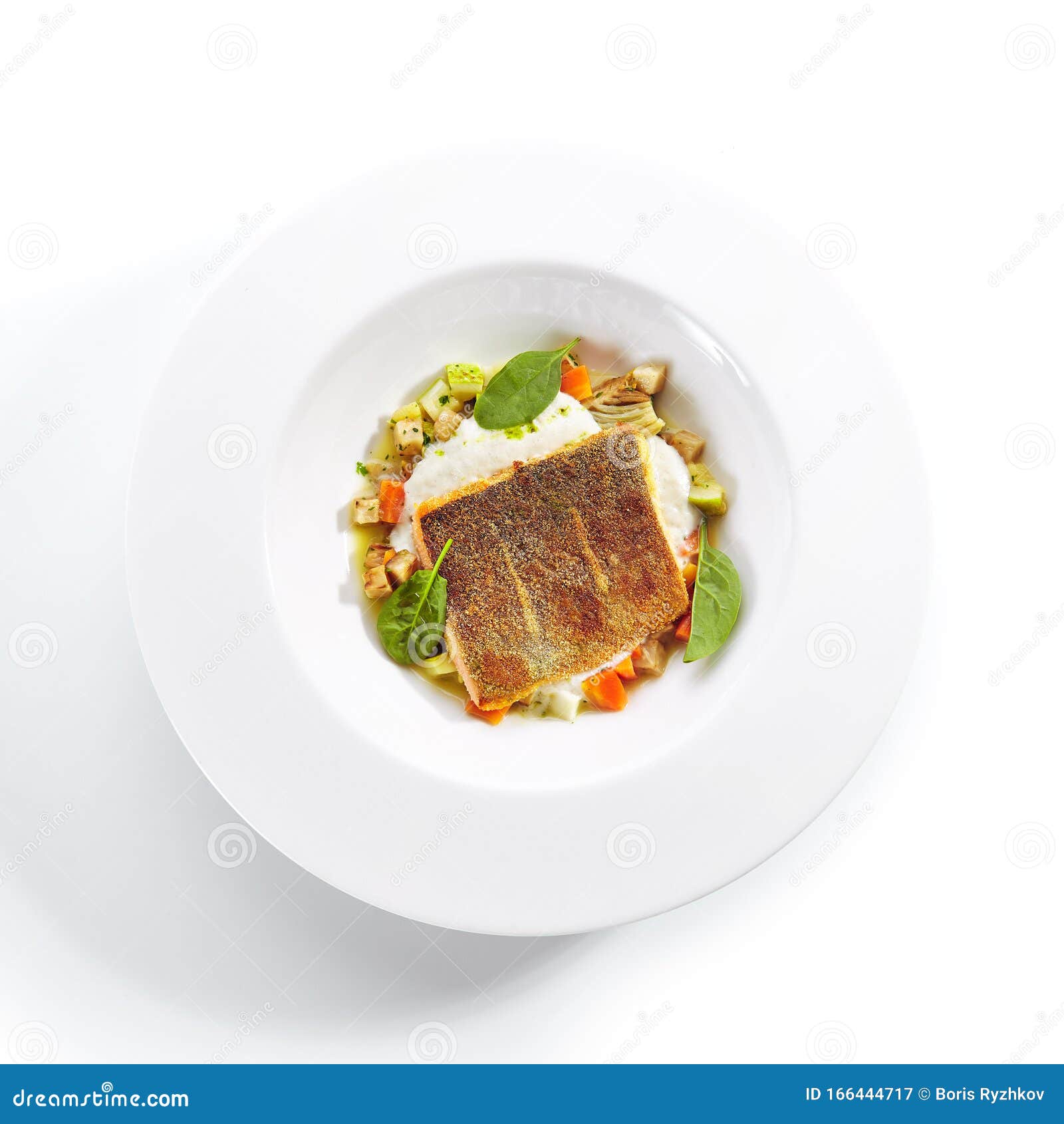 fried trout fillet and vegetable stew with herbs espuma