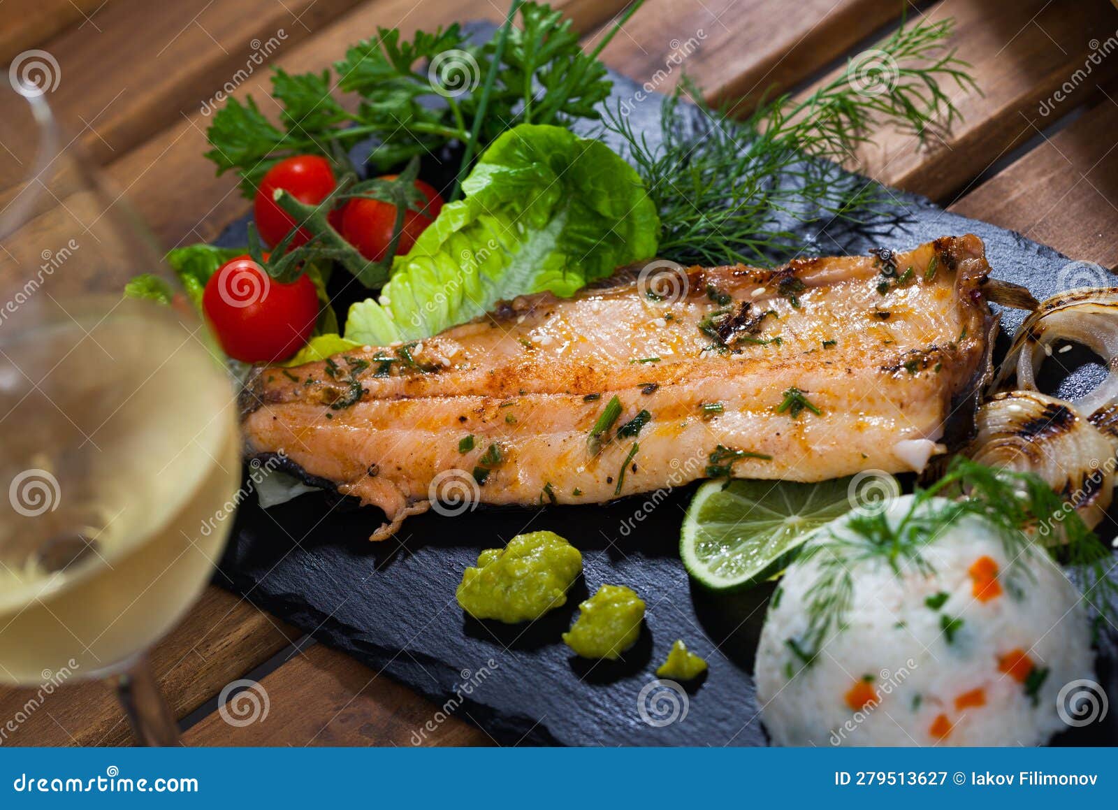 Fried Trout Fillets with Rice, Vegetables and White Wine Stock Image