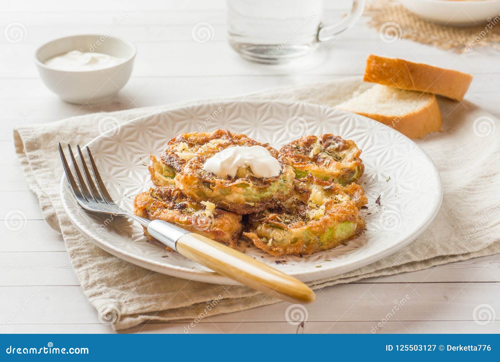 Fried Zucchini Slices in Egg Batter with Garlic on a Plate. Stock Image