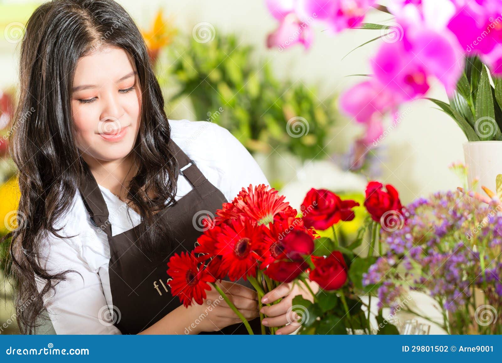 chinese saleswoman in a flower shop