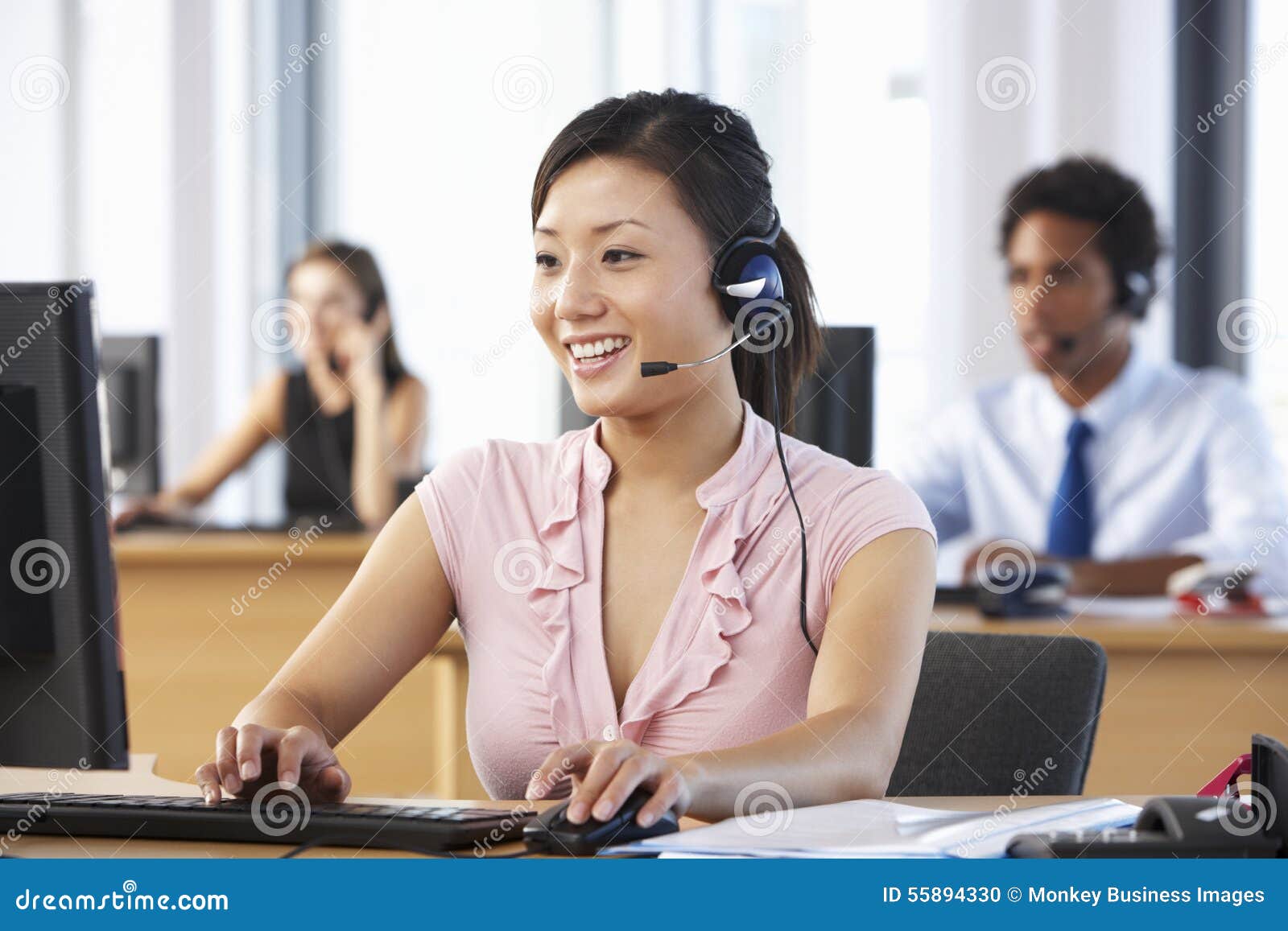 friendly customer service agent in call centre