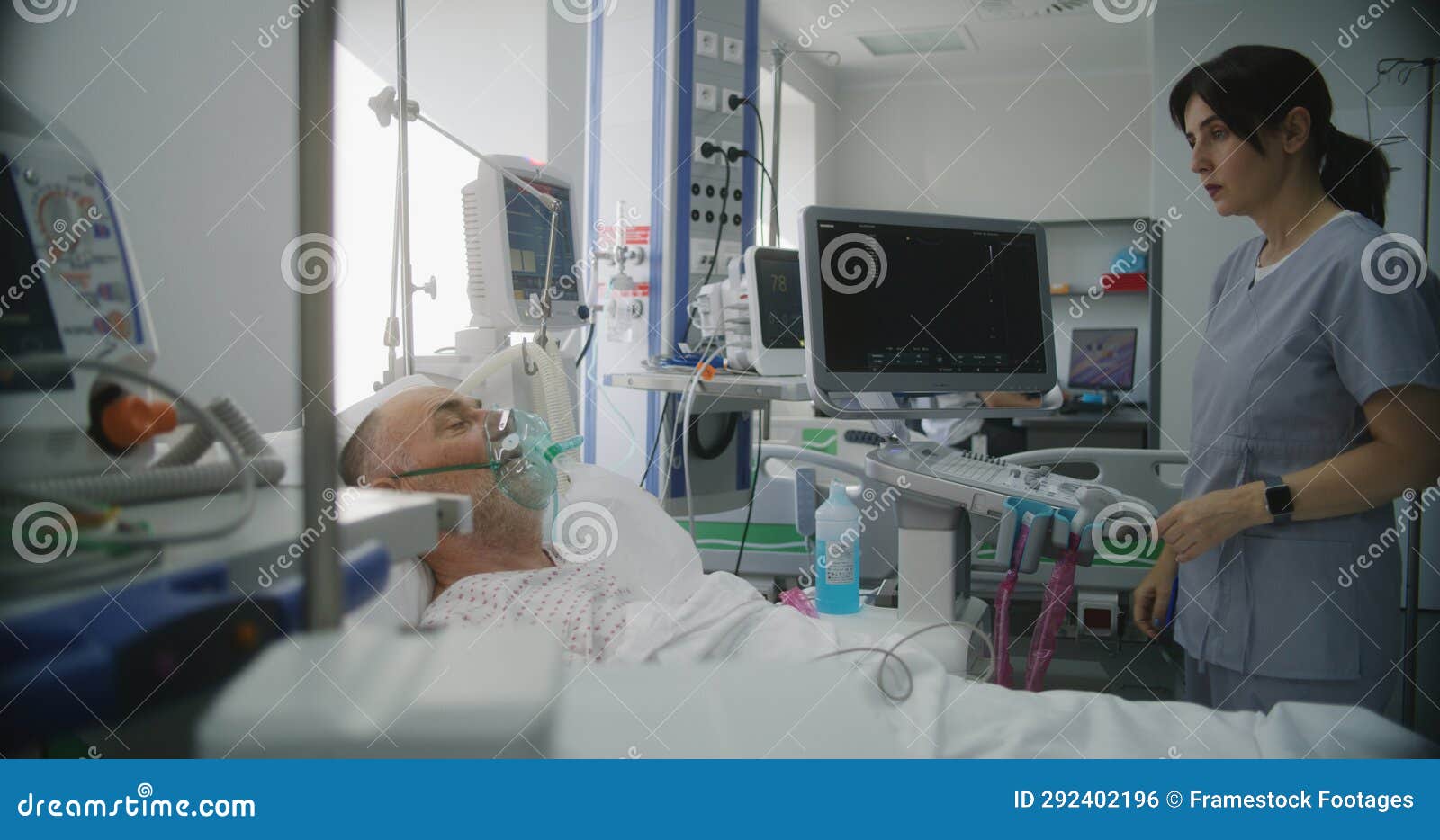 Friendly Nurse Adjusts Life Support Machine for Old Patient Stock Photo ...