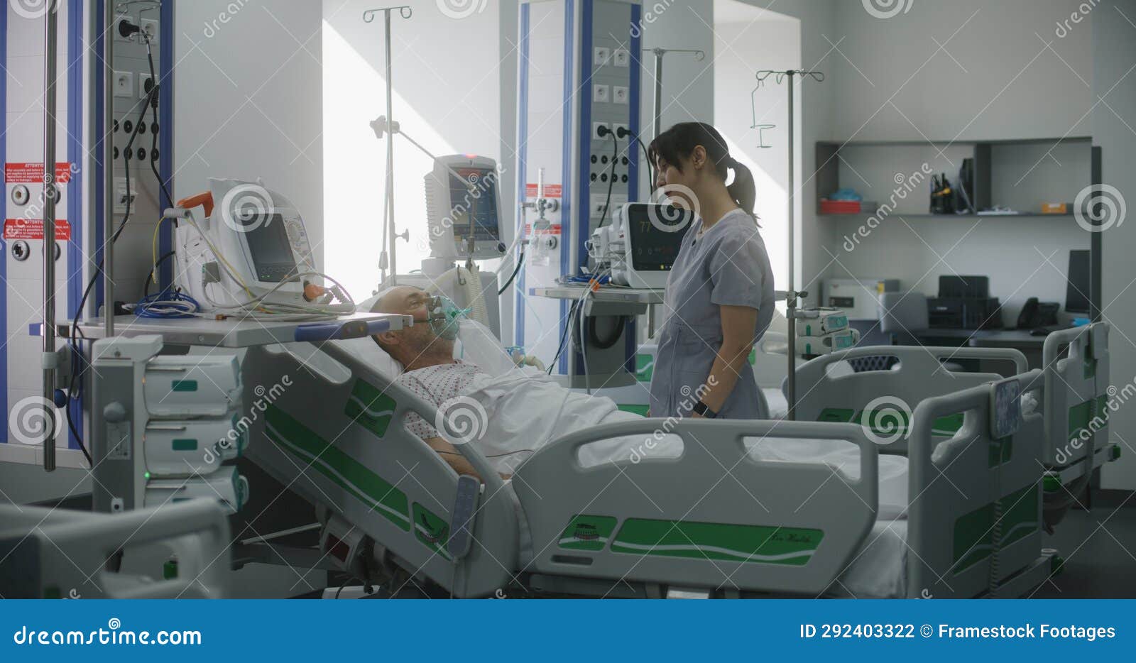 Friendly Nurse Adjusts Life Support Machine for Old Patient Stock Photo ...