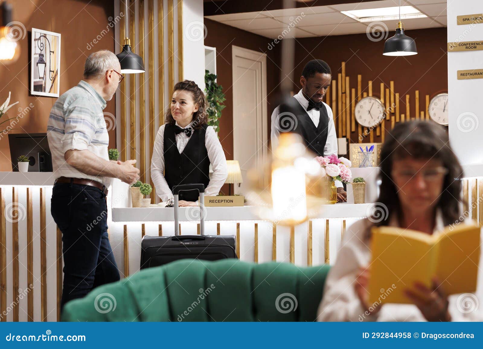 friendly receptionist assists guest