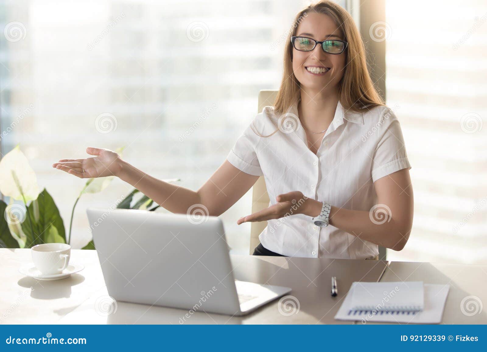 friendly receptionist invites visitors on meeting