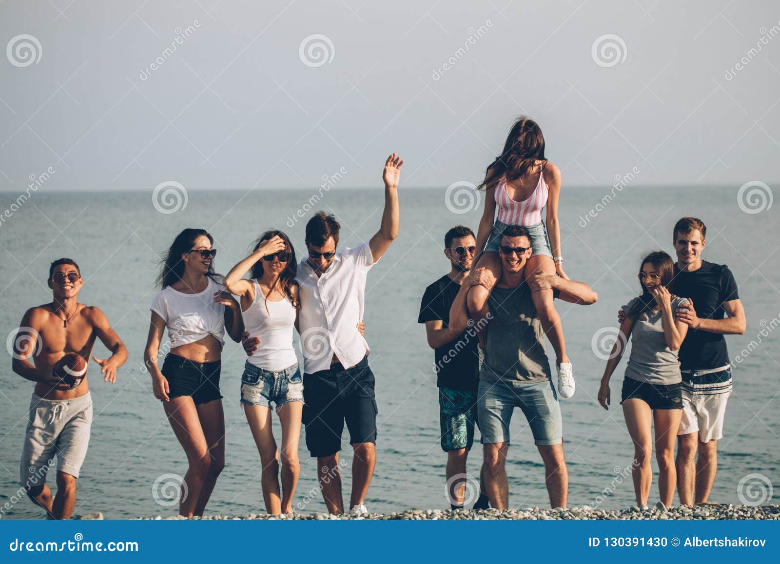 Group of Friends Walking at Beach, Having Fun, Womans Piggyback on Mans ...