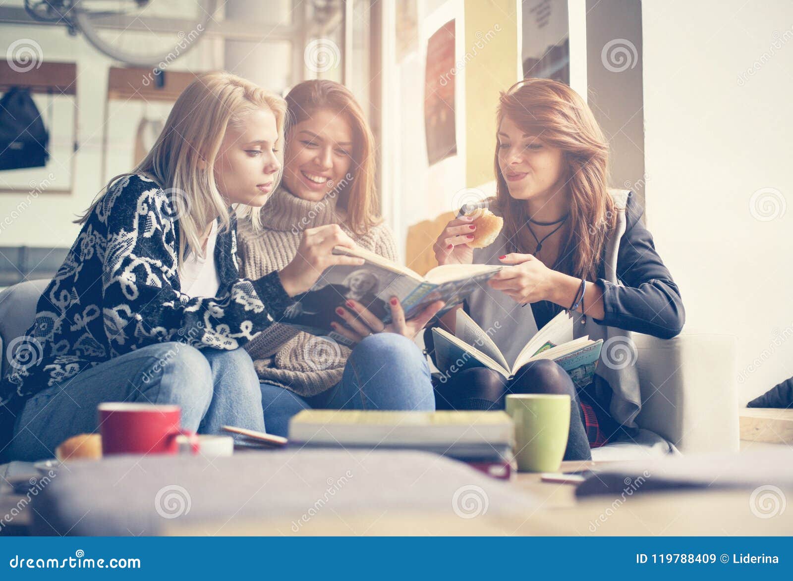 Friends in Cafe. Three Best Friends Learning and Eating Together ...