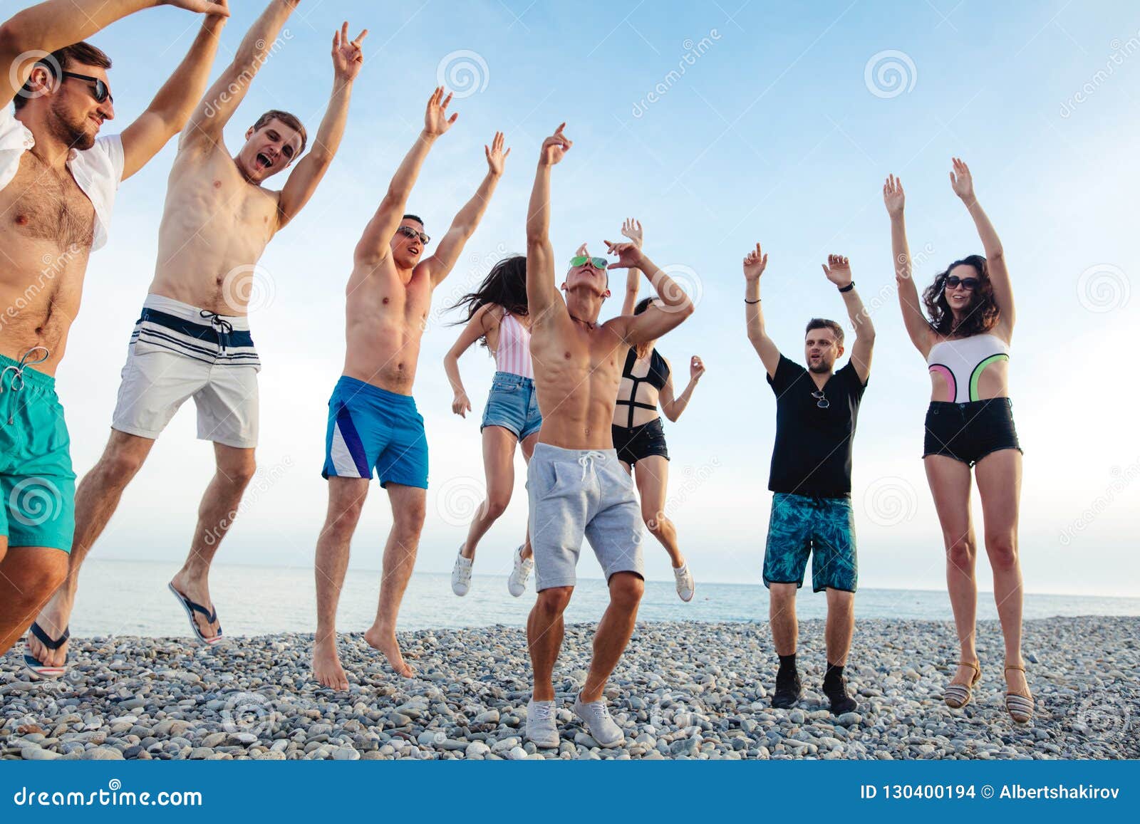 Friends Dance on Beach Under Sunset Sunlight, Having Fun, Happy, Enjoy ...