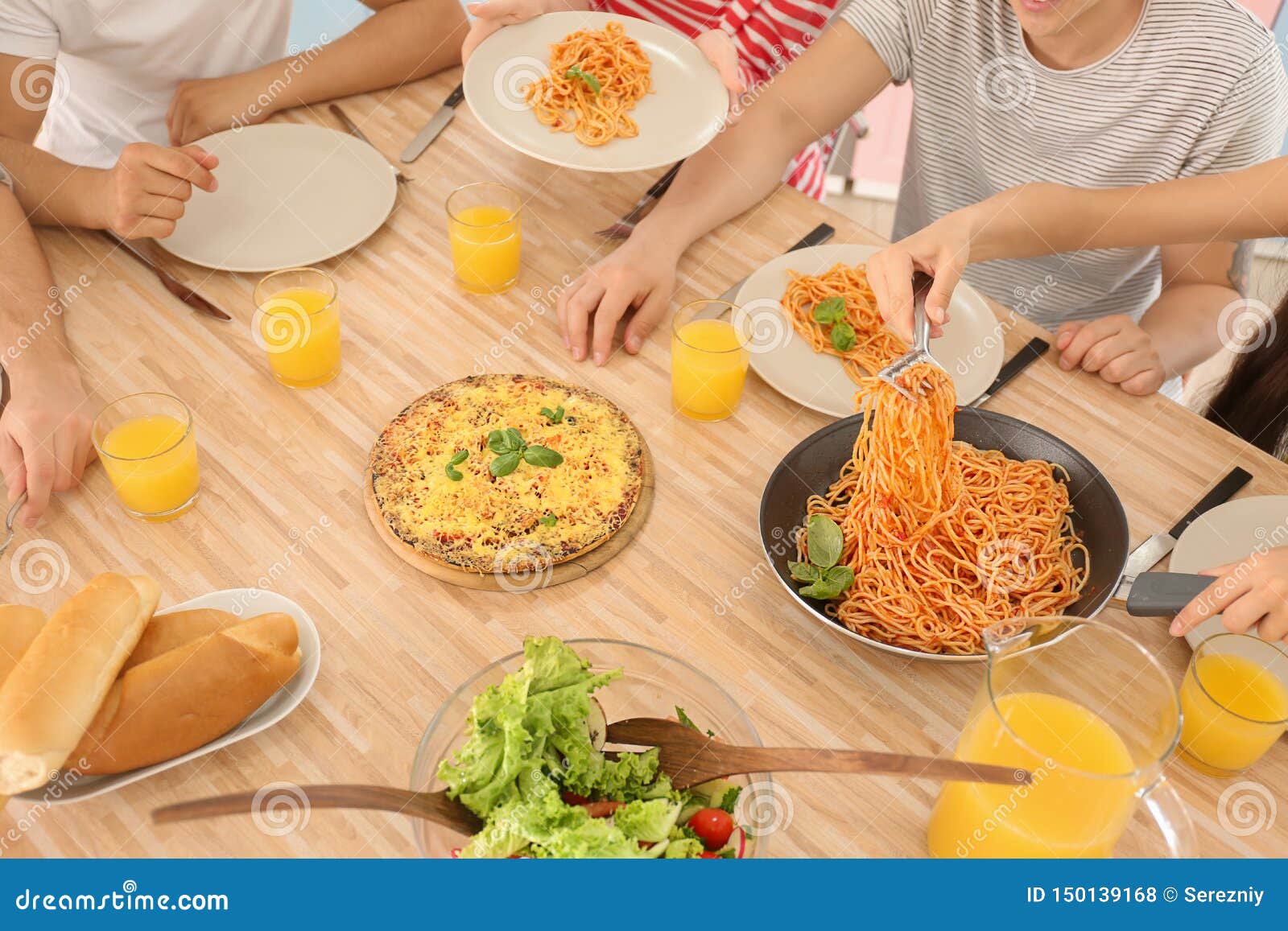 Friends Eating at Table in Kitchen Stock Photo Image of female, house