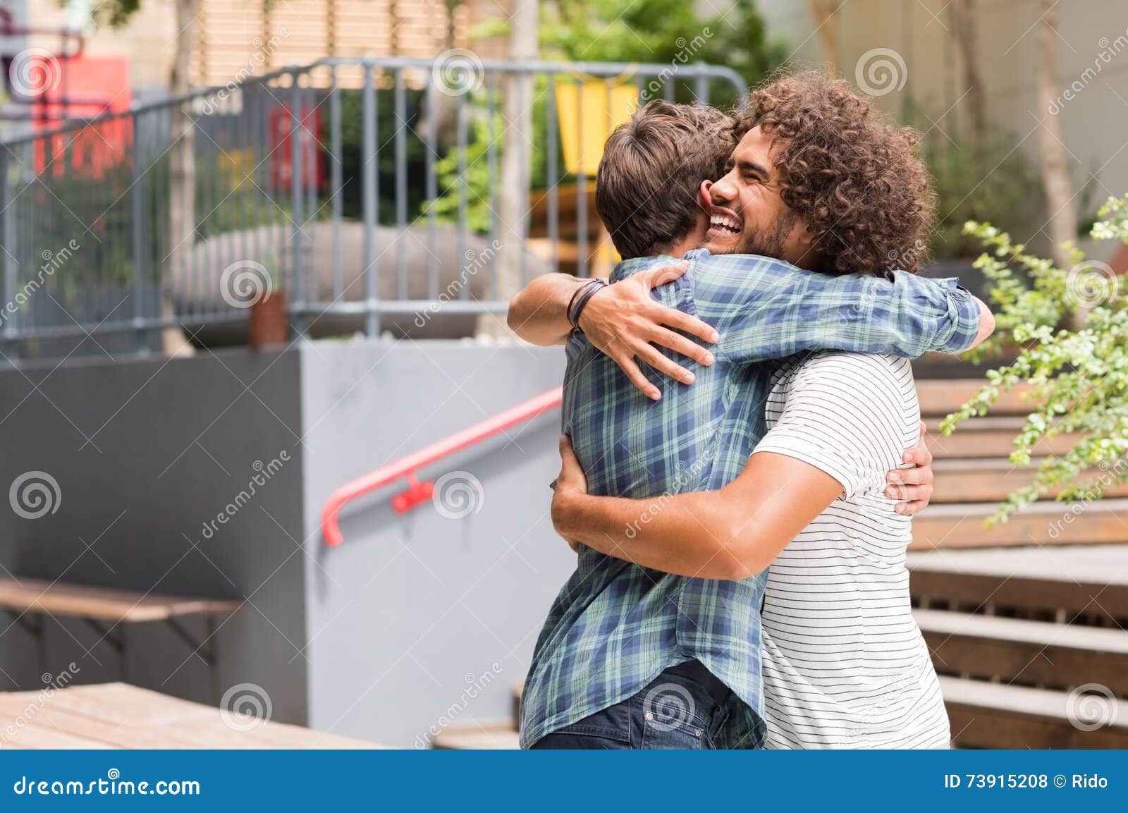Friends Embracing Each Other Stock Photo - Image of young, smile: 73915208