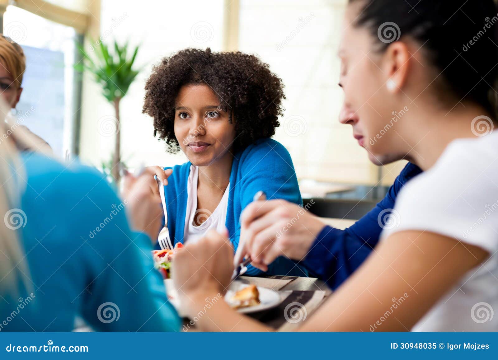 Friends Enjoying Dinner at a Restaurant Stock Image - Image of enjoy