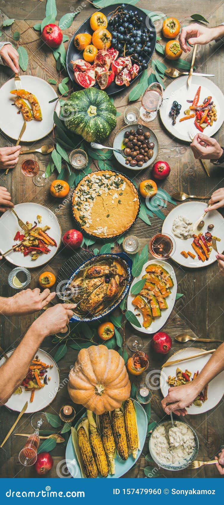 Friends Feasting at Thanksgiving Day Table with Turkey, Narrow ...