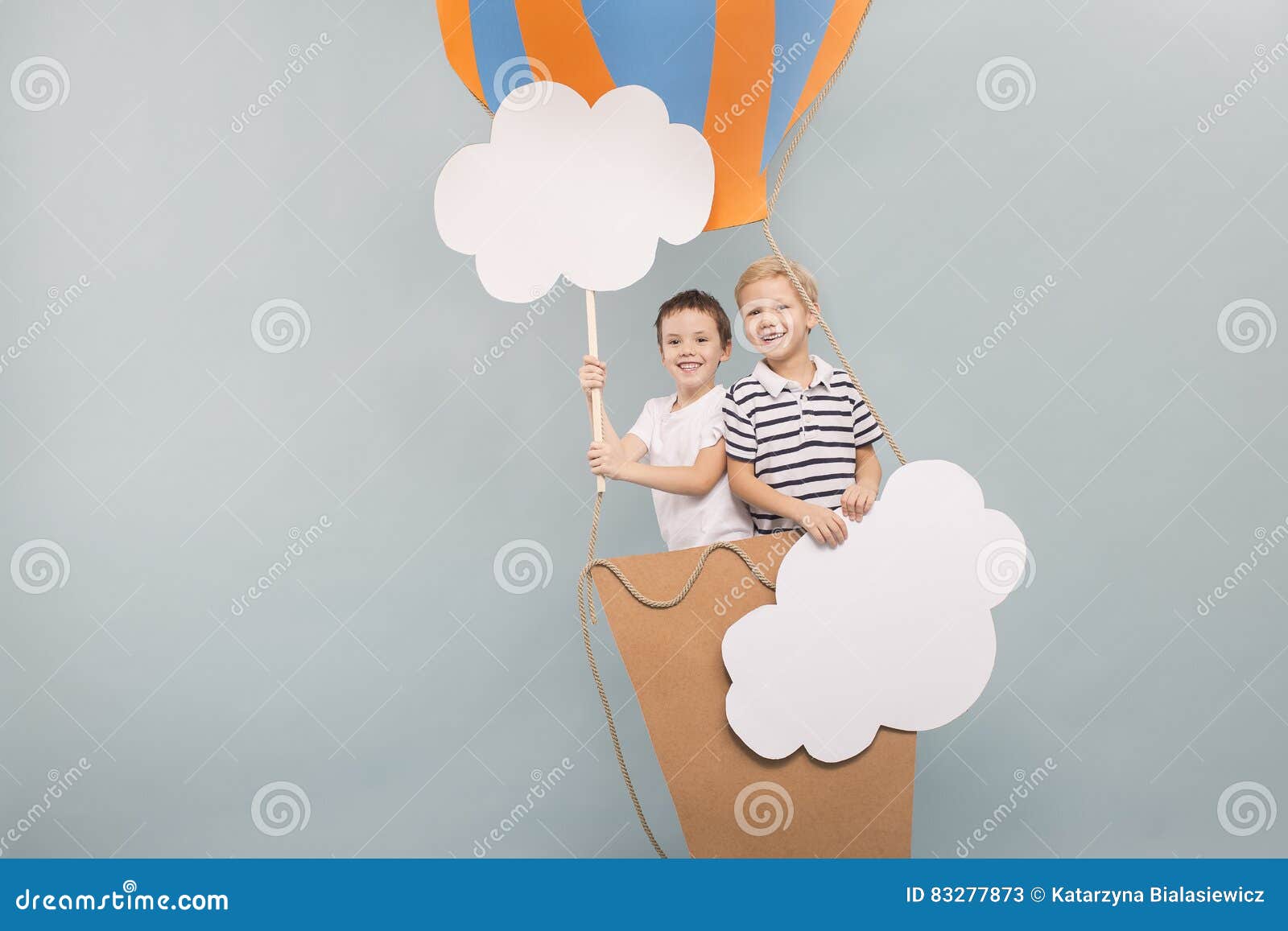 Friends flying in balloon stock image. Image of young 83277873