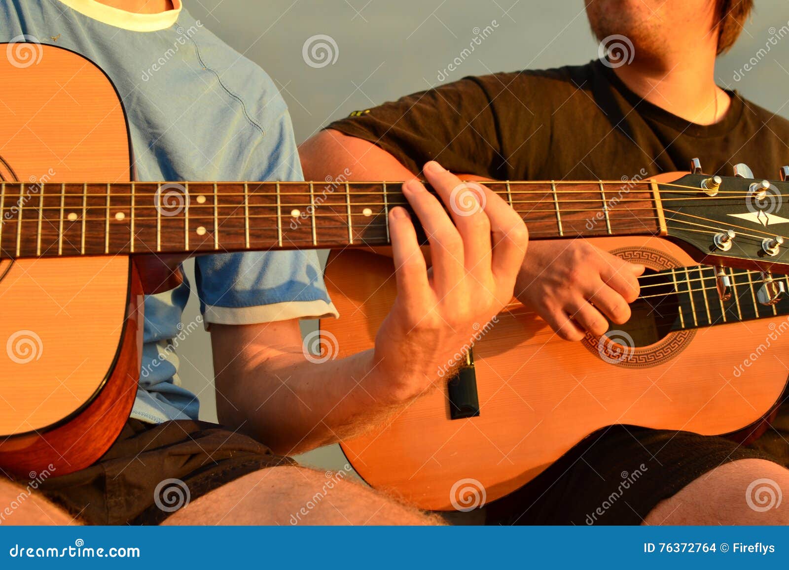 Friends playing guitar stock photo. Image of frets, guitarist - 76372764