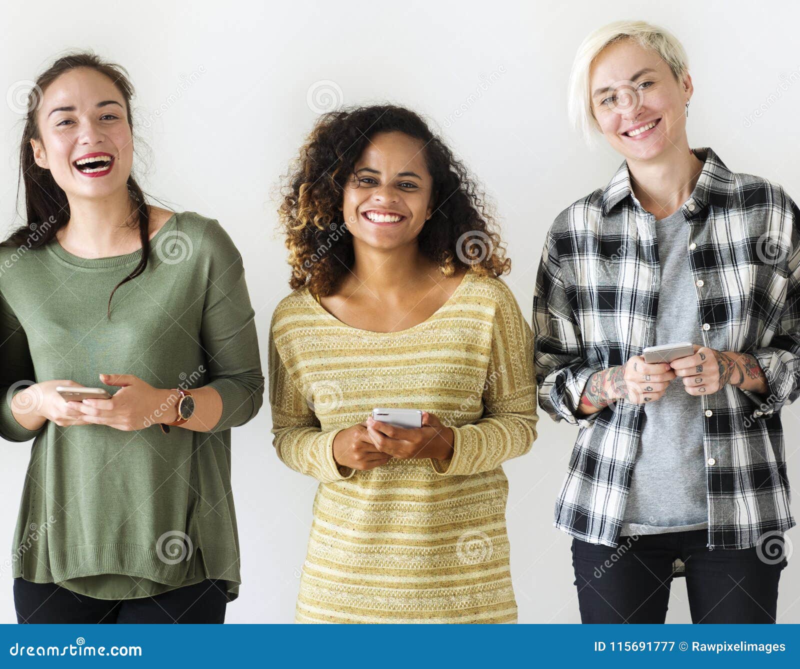 friends standing with their mobiles in hand