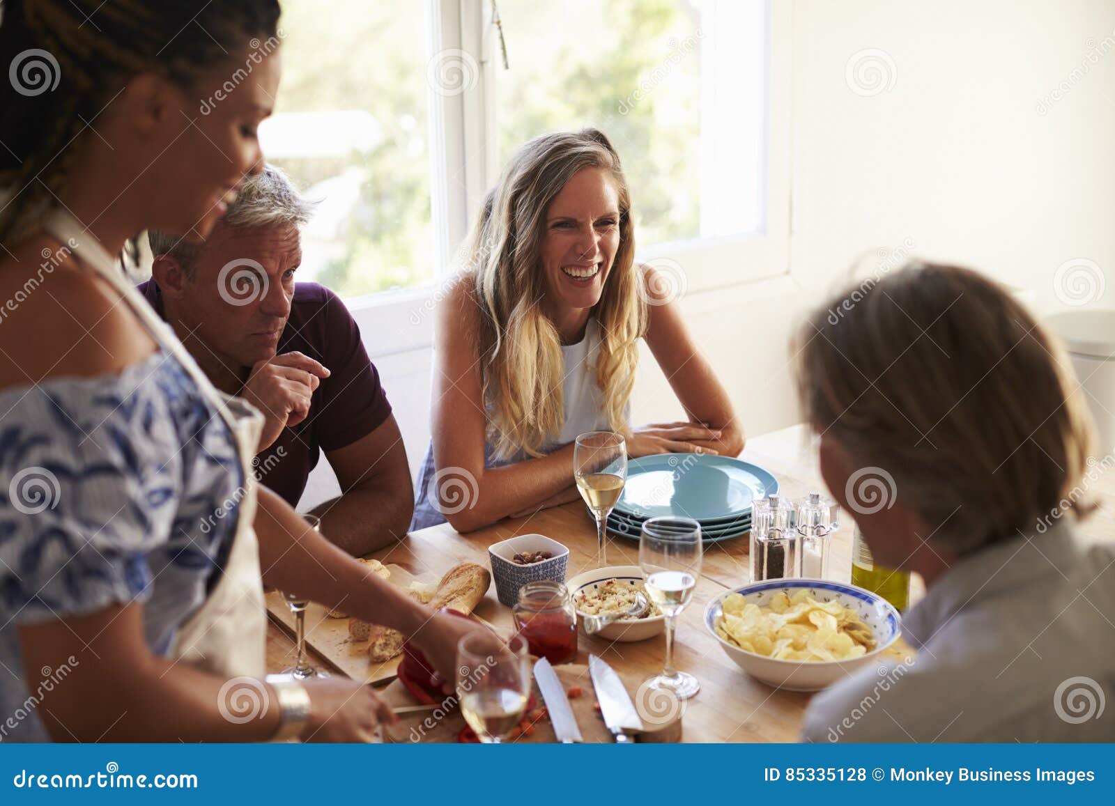 people talking across the kitchen table in asia