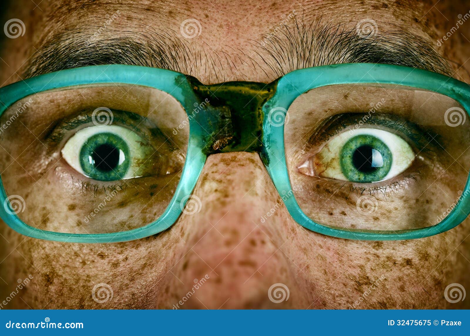 frightened look of a man in old glasses