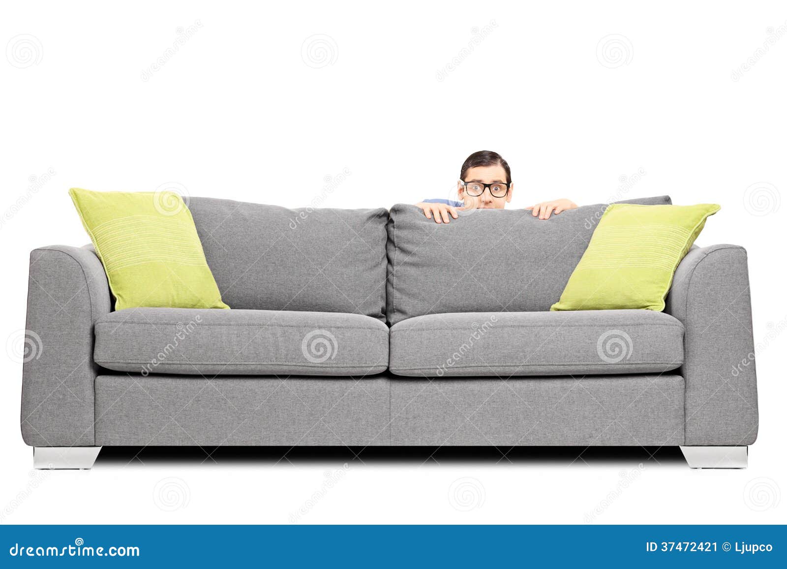 Frightened Man Hiding Behind A Sofa Stock Image Image Of