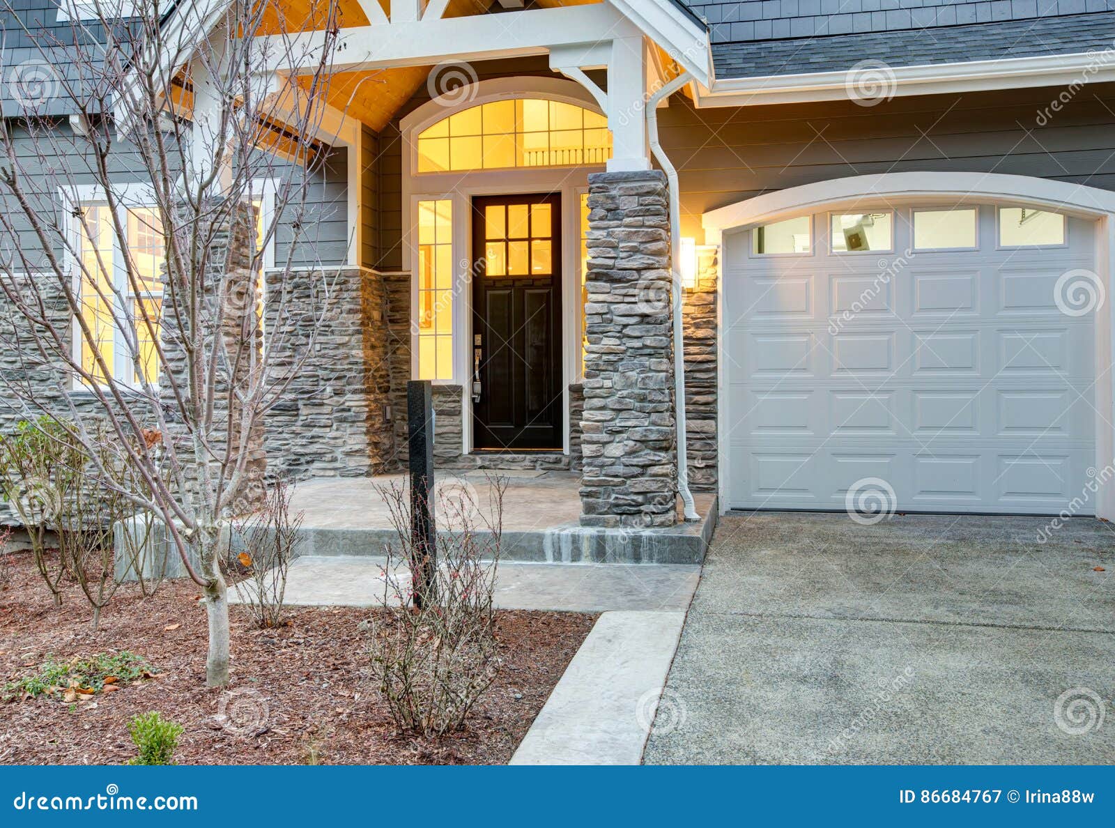 Front Covered Porch Design with Stone Columns Stock Image - Image ...