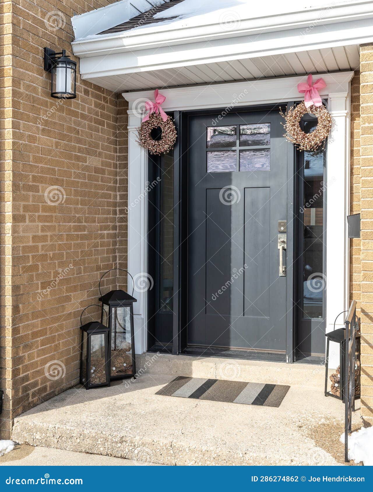 Detail of a Black Front Door on a Brick Home. Stock Photo Image of