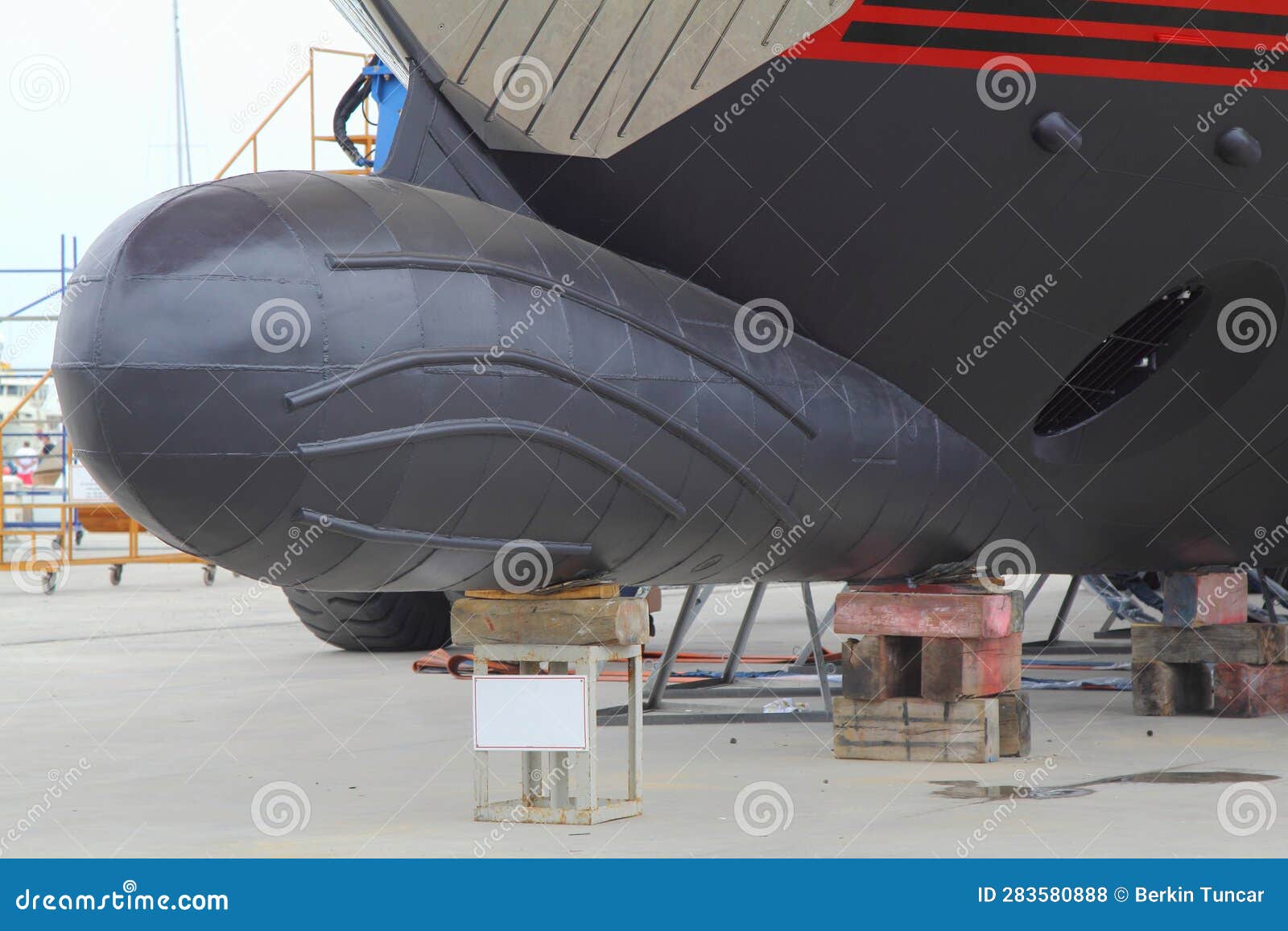The Front of a Large Yacht Docked on Wooden Blocks. Stock Photo Image