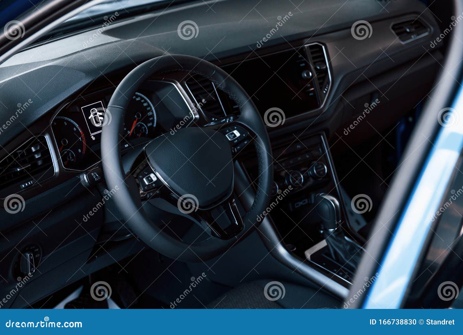 Front Panel of Luxury New Car in the Automobile Salon. Black Interior