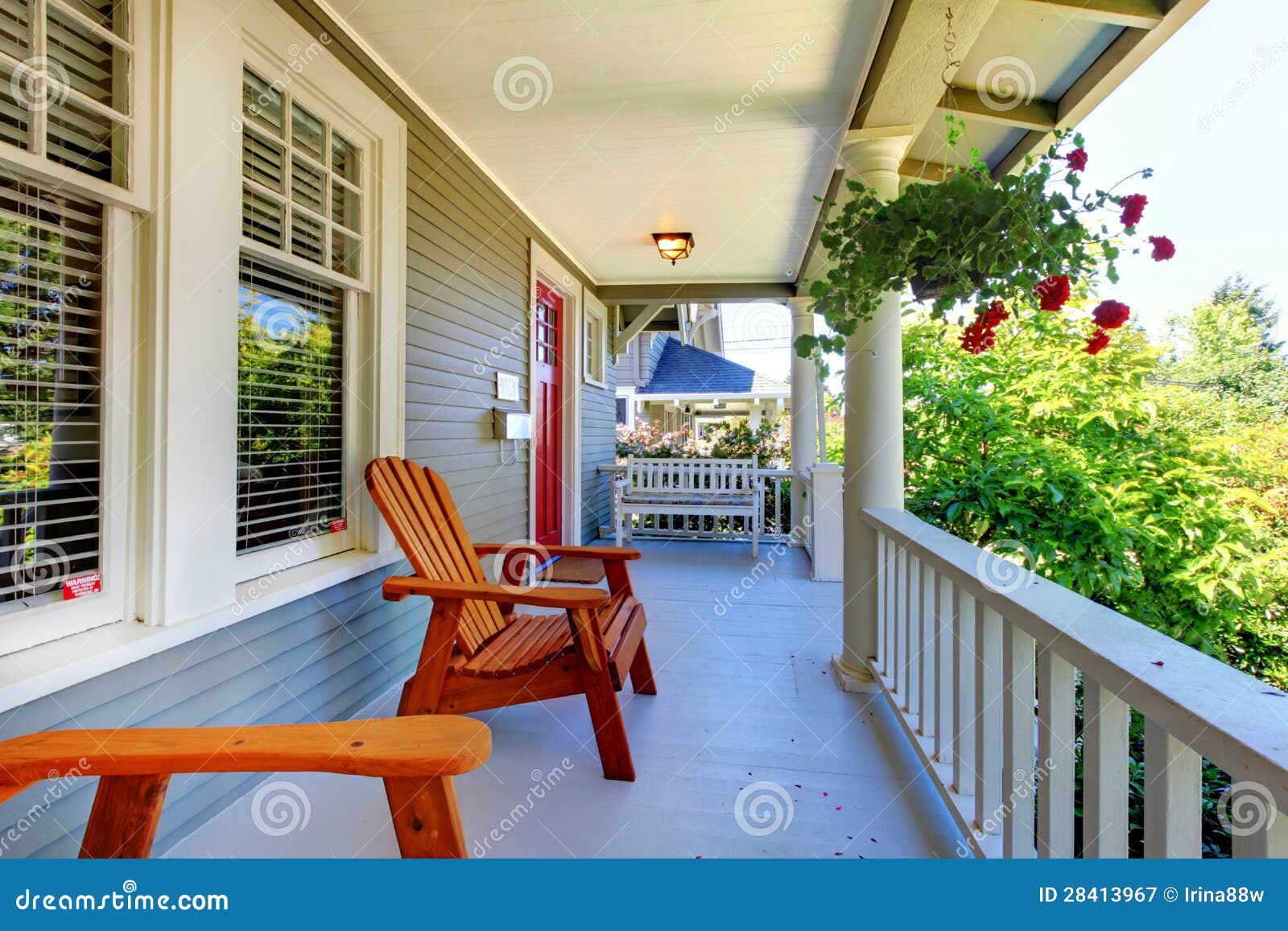front porch grey house white railings two windows 28413967