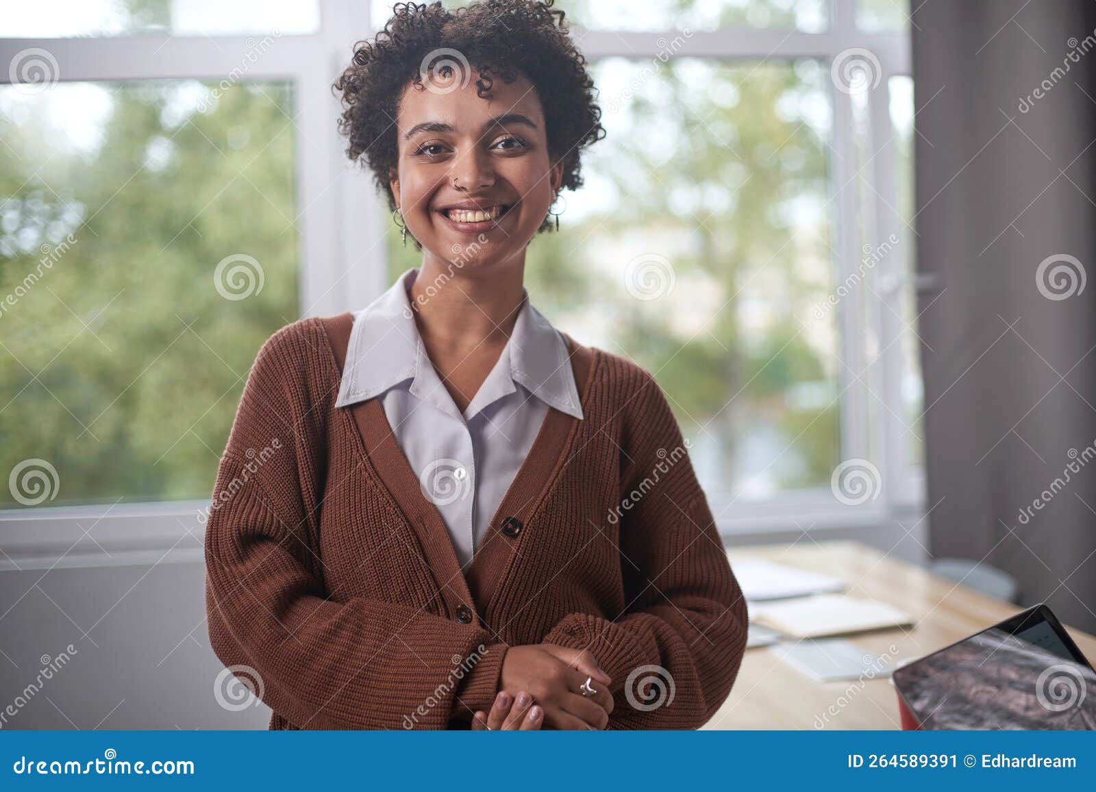 front portrait of pretty young woman in office