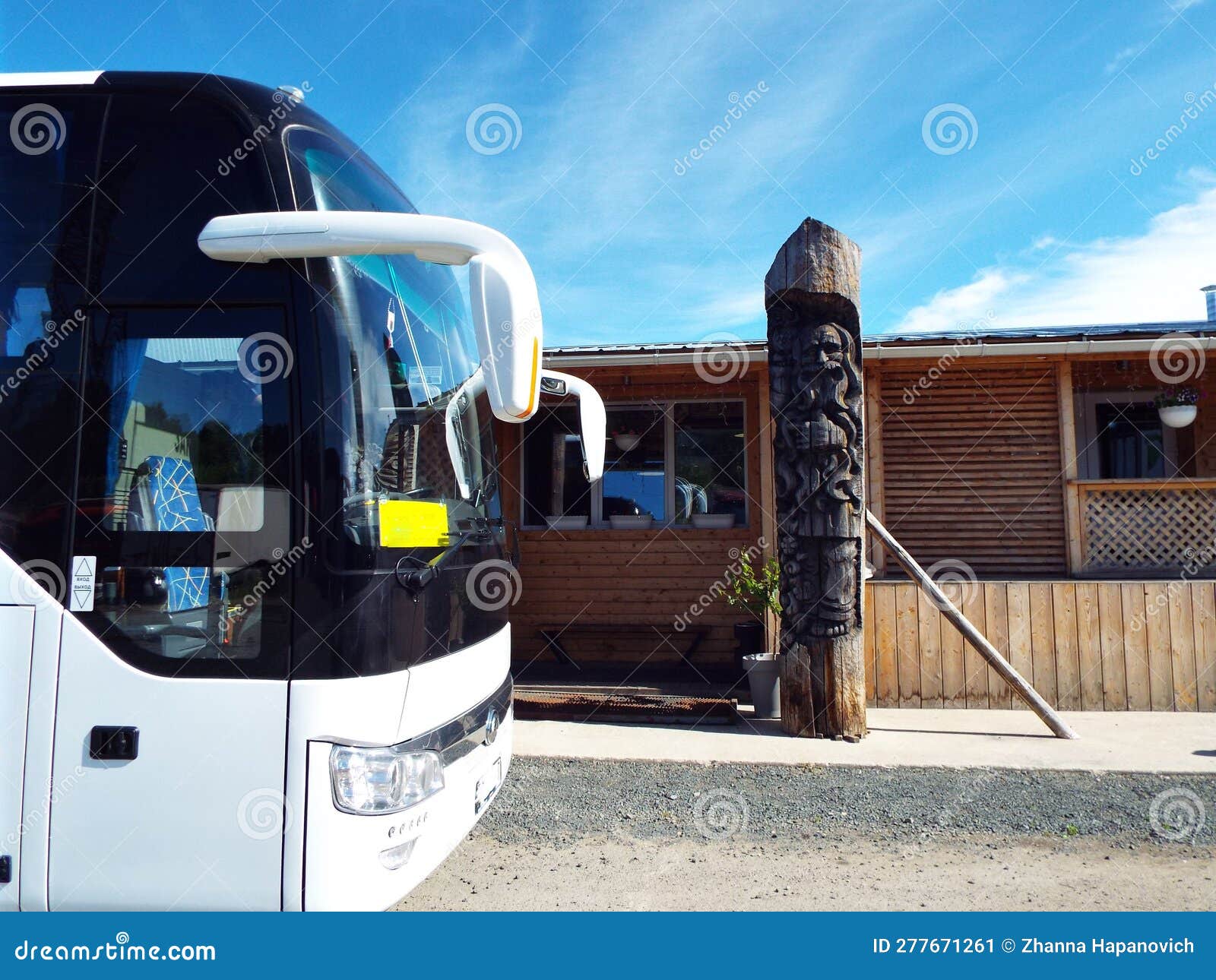 the front of the tourist bus against the backdrop of blue skies and local exoticism