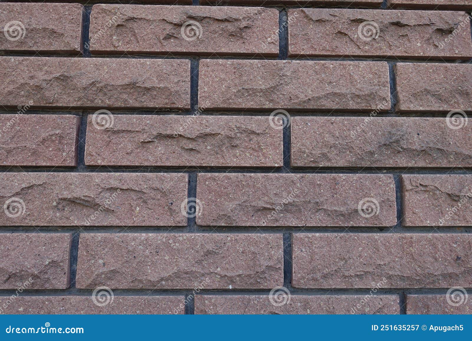 Front View of Brown Brick Veneer Wall with Black Mortar Joints Stock