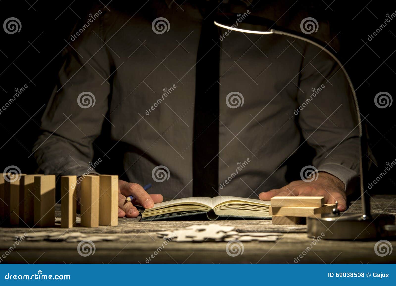 Front View Of Businessman Working Late Hours Sitting At His Office