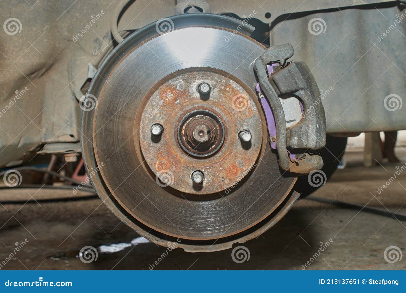 Front View of Car Wheel Hub and Brake Caliper System Stock Image