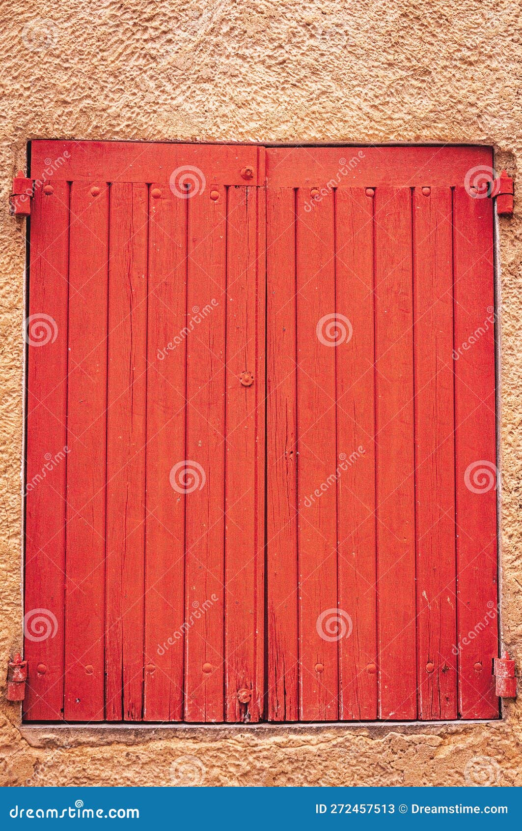 pair of closed, weathered, colorful, red, wood, window shutters, sablet, francepair of,