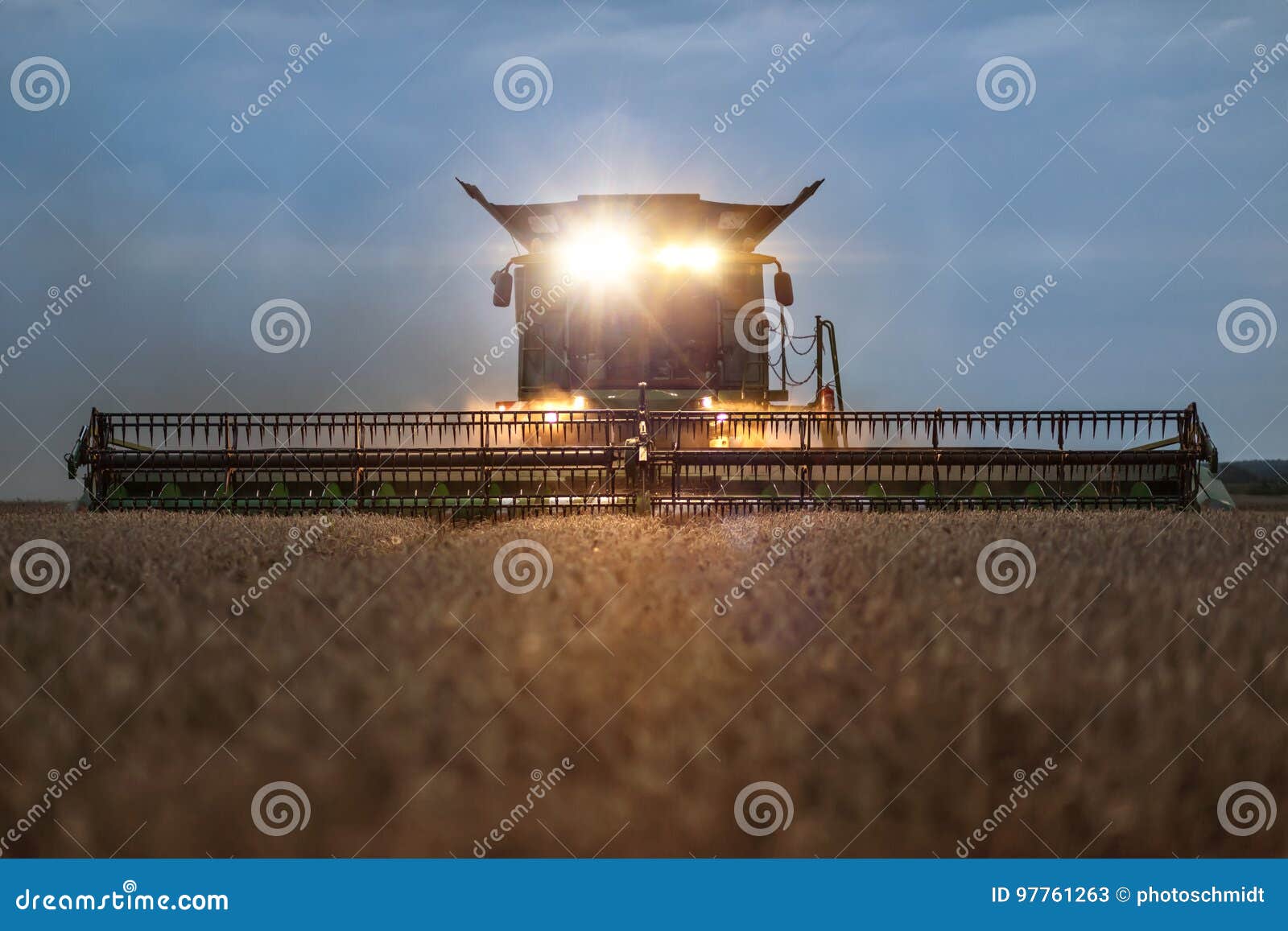 front view of a combine harvester in the evening