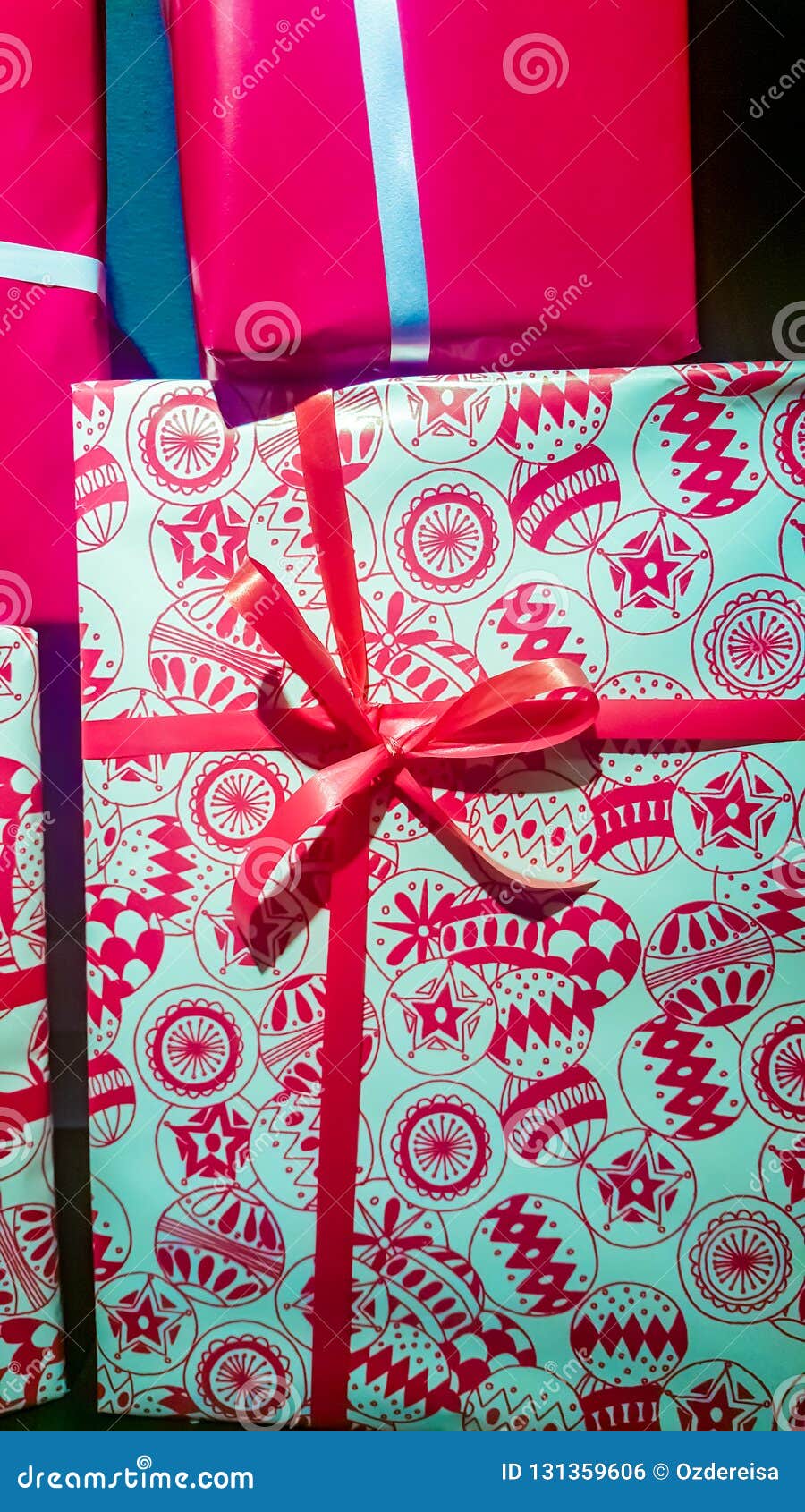 different size and color decorated gift boxes with ribbons