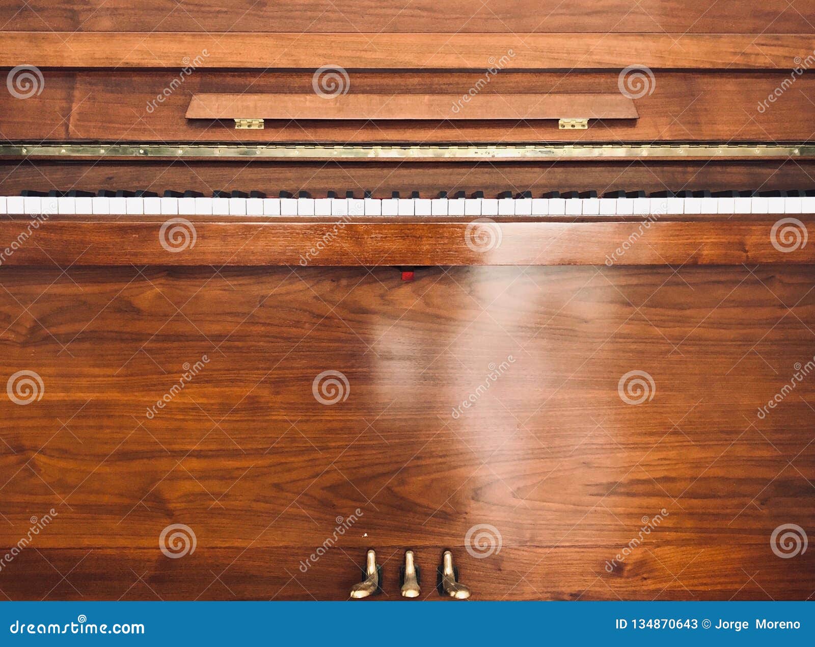 front of a wooden piano.