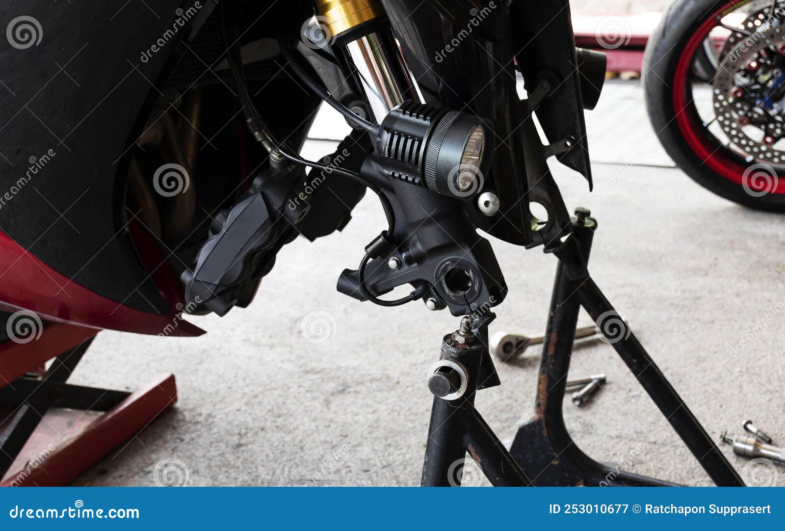 Front View Motorcycle Up To Stand To Remove Wheel To Change Tire Stock